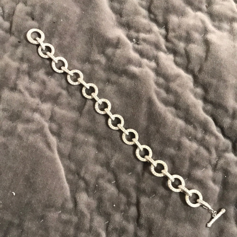 Pave rhinestone circle link silver tone bracelet